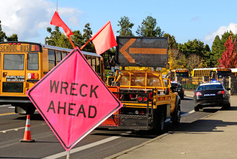 Large sign on a roadway that says "wreck ahead" indicating that there's been a car accident. Mirador Law - Pleasanton car accident lawyers